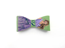 Load image into Gallery viewer, Bow clips with a design of taylor swift on green background