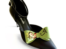 Load image into Gallery viewer, Green bow clips with a graphic design of a googoosh