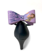 Load image into Gallery viewer, Bow clips with a design of taylor swift on purple background
