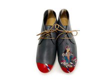 Load image into Gallery viewer, Charcoal  leather chukka Italian shoes with a hand-painted Queen design and bold red paint on the toes.
