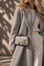 Load image into Gallery viewer, Signature N Braque gray leather bag worn crossbody with a gray wool coat
